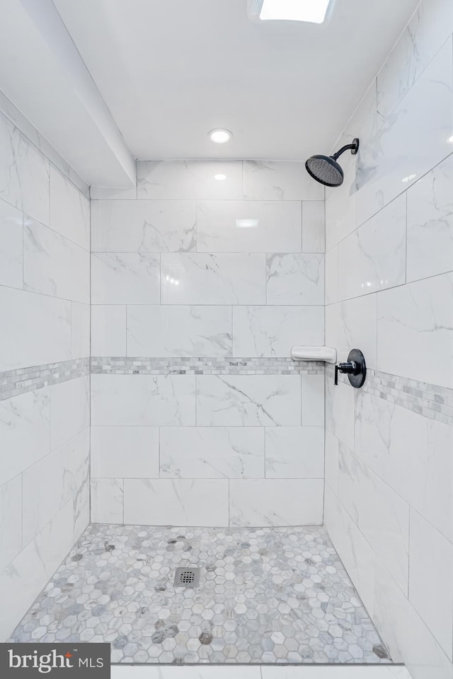 full bath with recessed lighting and a tile shower