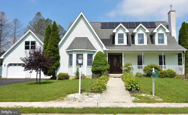 cape cod home with a garage, a front yard, and a porch