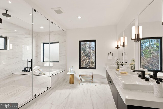 bathroom with an enclosed shower and vanity