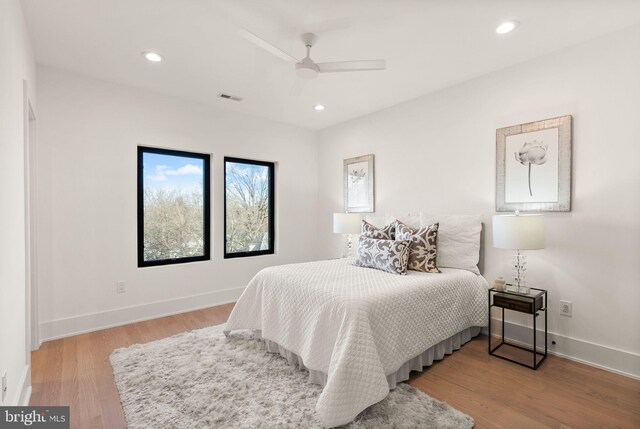 bedroom featuring light hardwood / wood-style flooring and ceiling fan