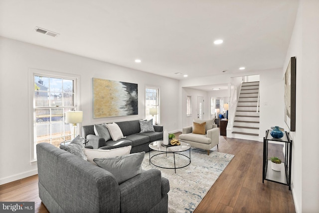 living room featuring plenty of natural light and hardwood / wood-style floors