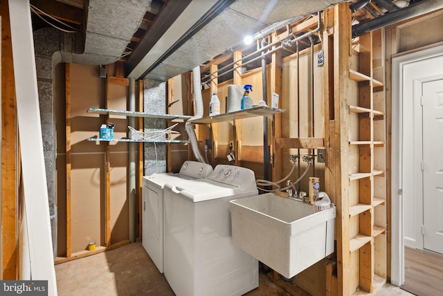 laundry area featuring sink and washer and dryer