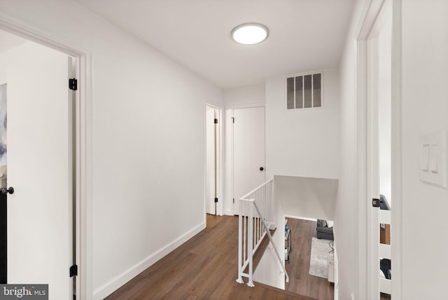 hall featuring dark wood-type flooring