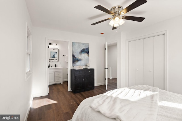 bedroom with connected bathroom, sink, dark hardwood / wood-style flooring, ceiling fan, and a closet