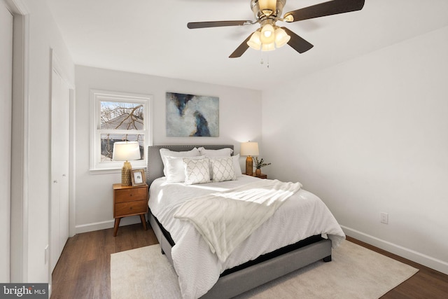 bedroom featuring ceiling fan and dark hardwood / wood-style flooring