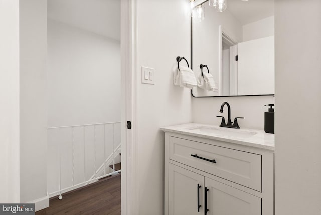 bathroom with vanity and wood-type flooring