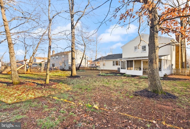 view of yard featuring a sunroom