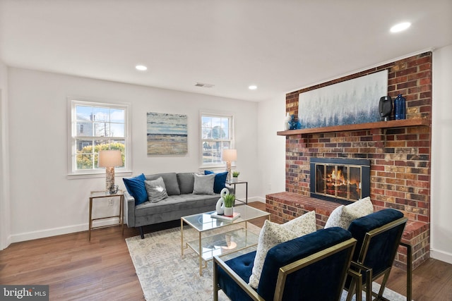 living room featuring hardwood / wood-style floors and a fireplace