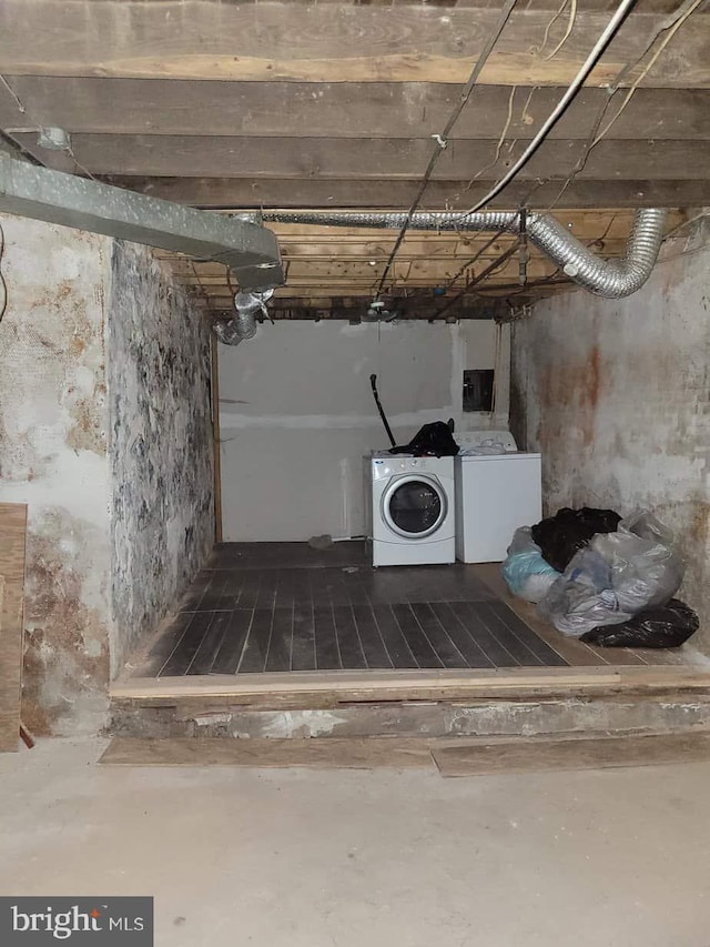 unfinished below grade area with washer and dryer