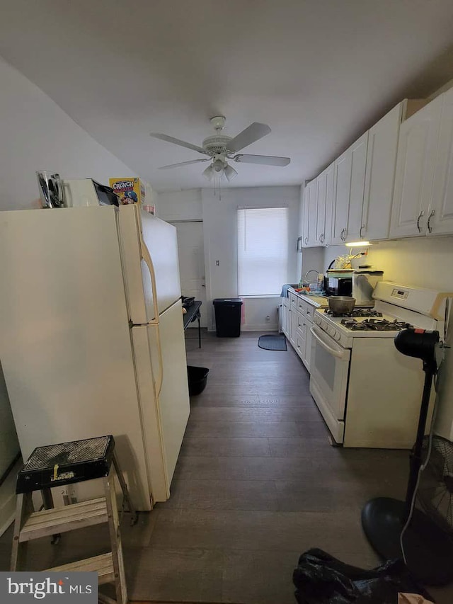 kitchen with ceiling fan, white appliances, dark wood-style flooring, and white cabinets