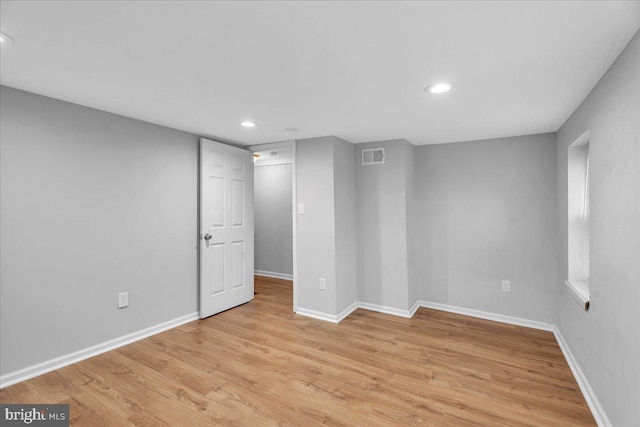 spare room featuring light wood-type flooring