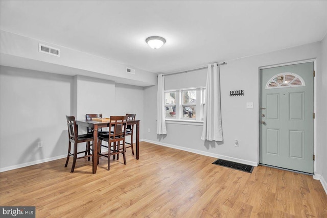 dining space featuring light hardwood / wood-style floors