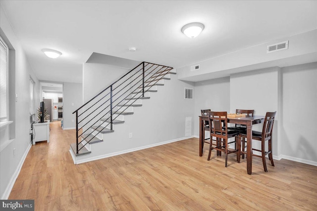 dining area featuring light wood-type flooring