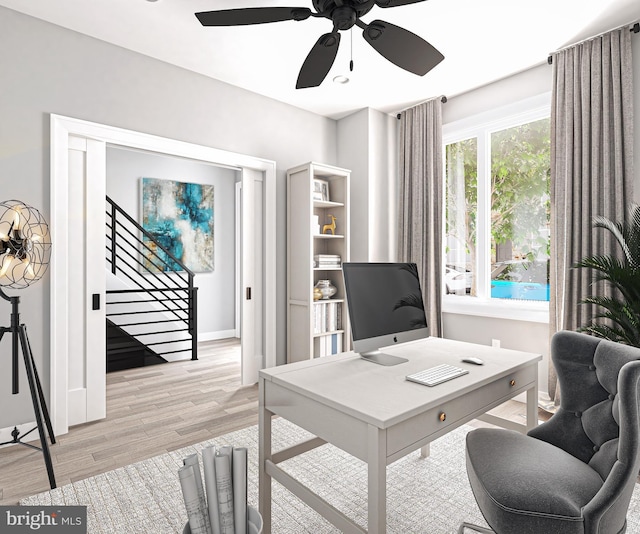 office with ceiling fan and light wood-type flooring