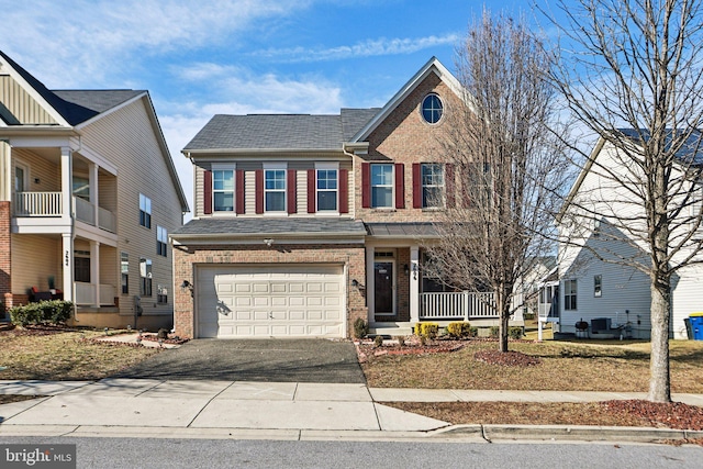 view of front of property featuring central AC unit and a garage