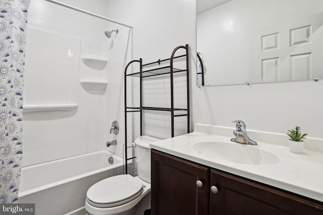 full bathroom with vanity, shower / bath combo with shower curtain, and toilet