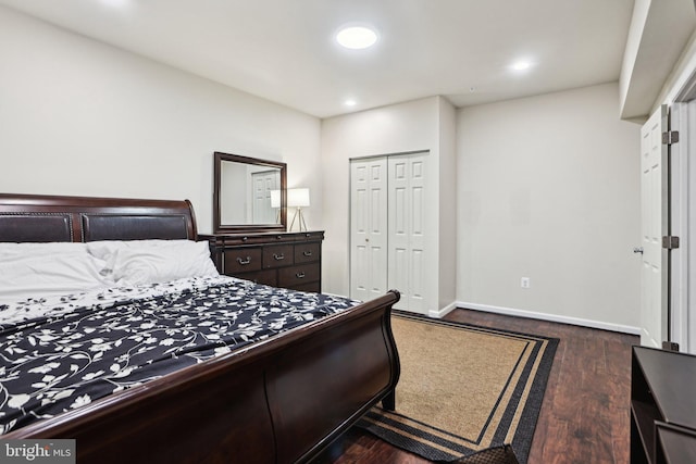 bedroom featuring dark hardwood / wood-style flooring and a closet