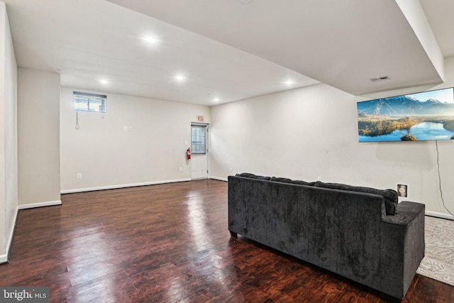 living room featuring dark hardwood / wood-style flooring