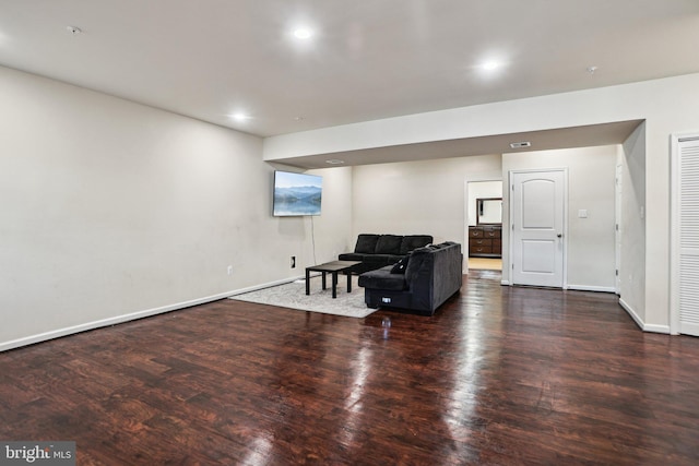 sitting room featuring dark wood-type flooring