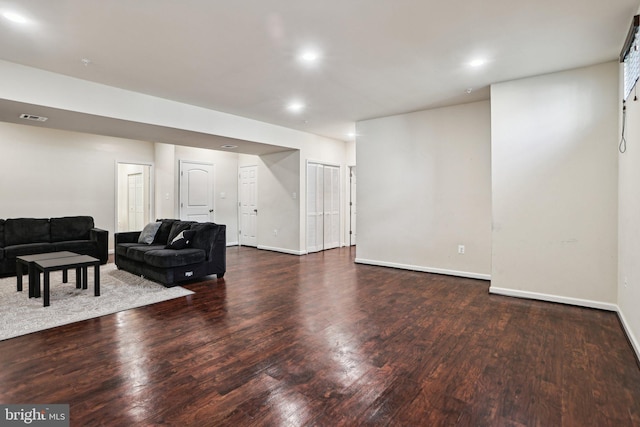 living room with dark wood-type flooring