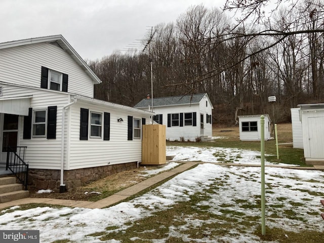 view of front of home with a storage unit