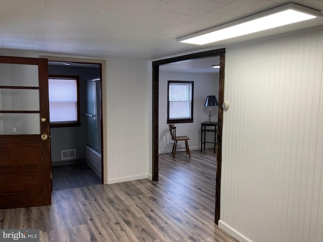 corridor featuring hardwood / wood-style flooring