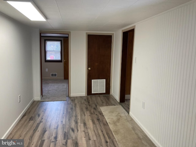 empty room featuring dark hardwood / wood-style flooring