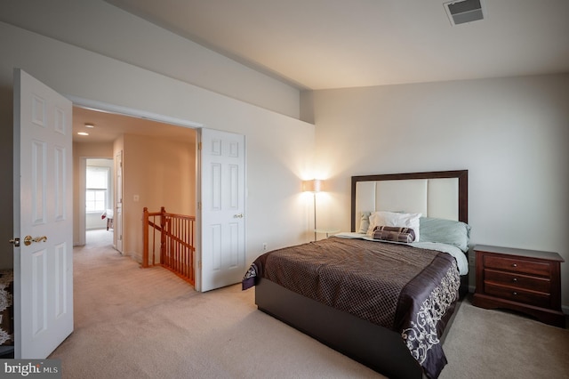 carpeted bedroom featuring vaulted ceiling