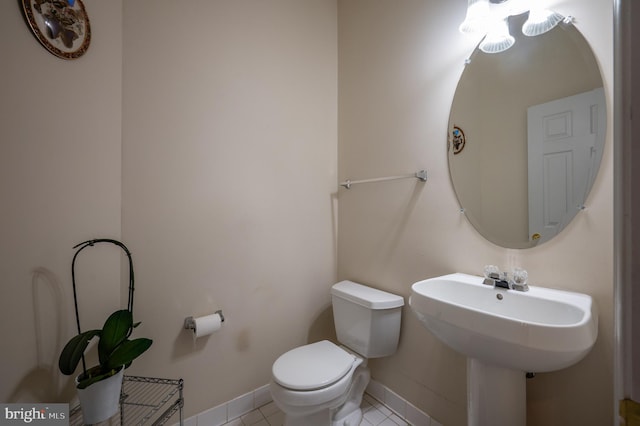 bathroom featuring tile patterned floors and toilet