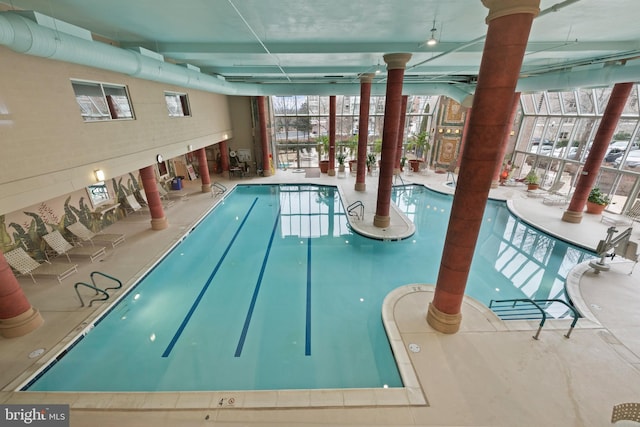 view of pool with a lanai and a patio