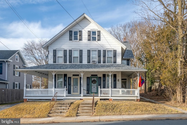 country-style home with a porch