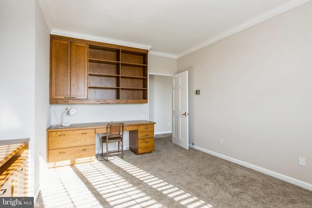 unfurnished office with ornamental molding and light colored carpet