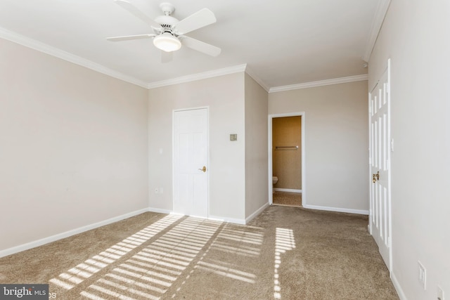 unfurnished bedroom with carpet floors, ornamental molding, and ceiling fan