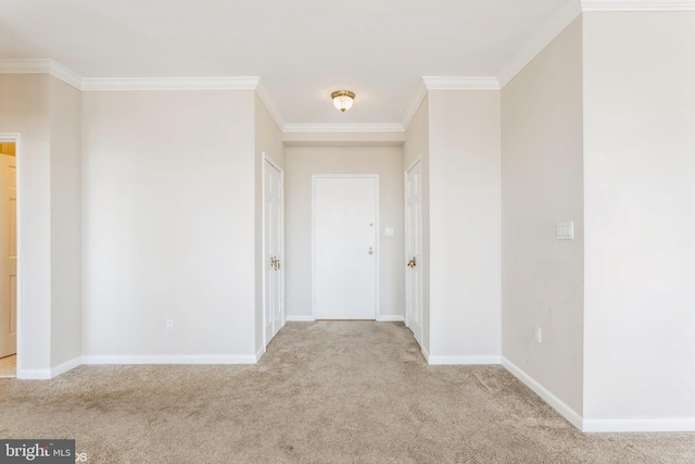 corridor with ornamental molding and light carpet