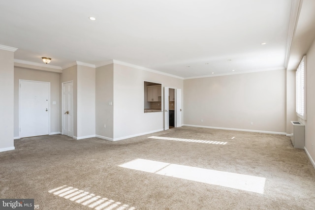 empty room with ornamental molding and light carpet