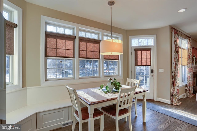 dining room with dark wood-type flooring