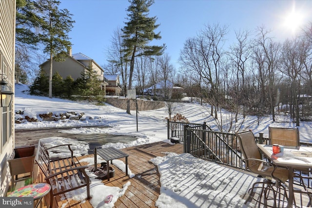 view of snow covered deck