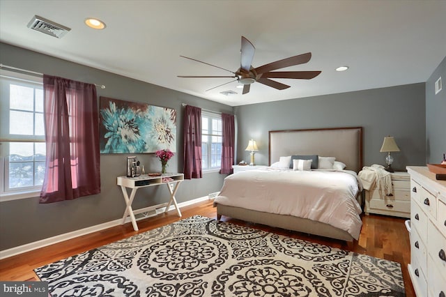 bedroom with ceiling fan and wood-type flooring