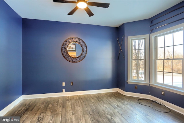 unfurnished room featuring hardwood / wood-style flooring and ceiling fan