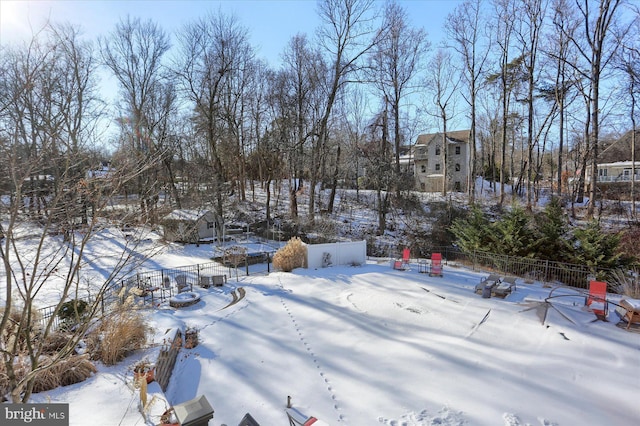 view of yard covered in snow