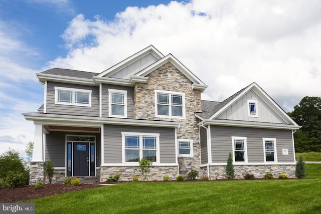 craftsman-style house with a front yard