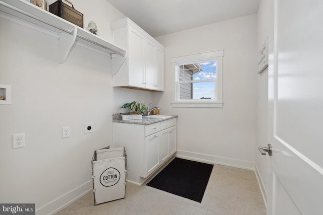 laundry area featuring cabinets, electric dryer hookup, sink, and hookup for a washing machine