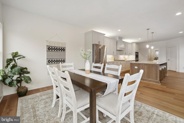 dining space featuring light wood-type flooring