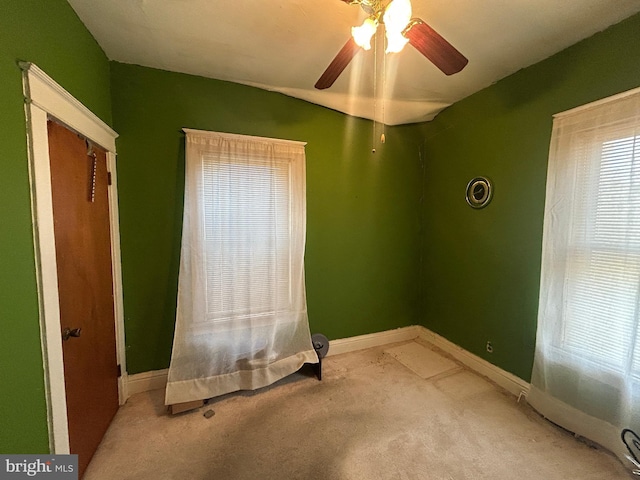 unfurnished bedroom featuring ceiling fan, carpet flooring, and baseboards