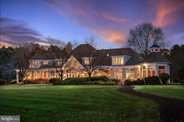 view of front of house with a lawn