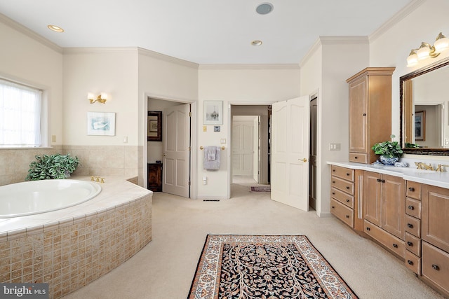 bathroom with vanity, a relaxing tiled tub, and crown molding