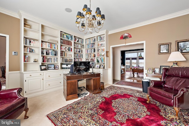 carpeted office featuring crown molding, built in shelves, and a chandelier