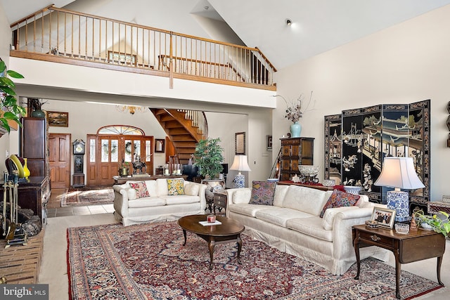 living room featuring high vaulted ceiling