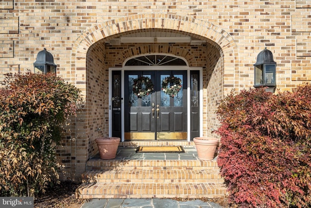 view of exterior entry featuring french doors