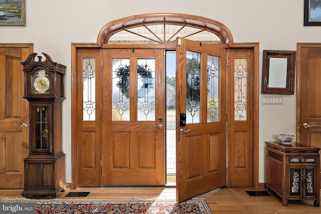 foyer entrance with light wood-type flooring